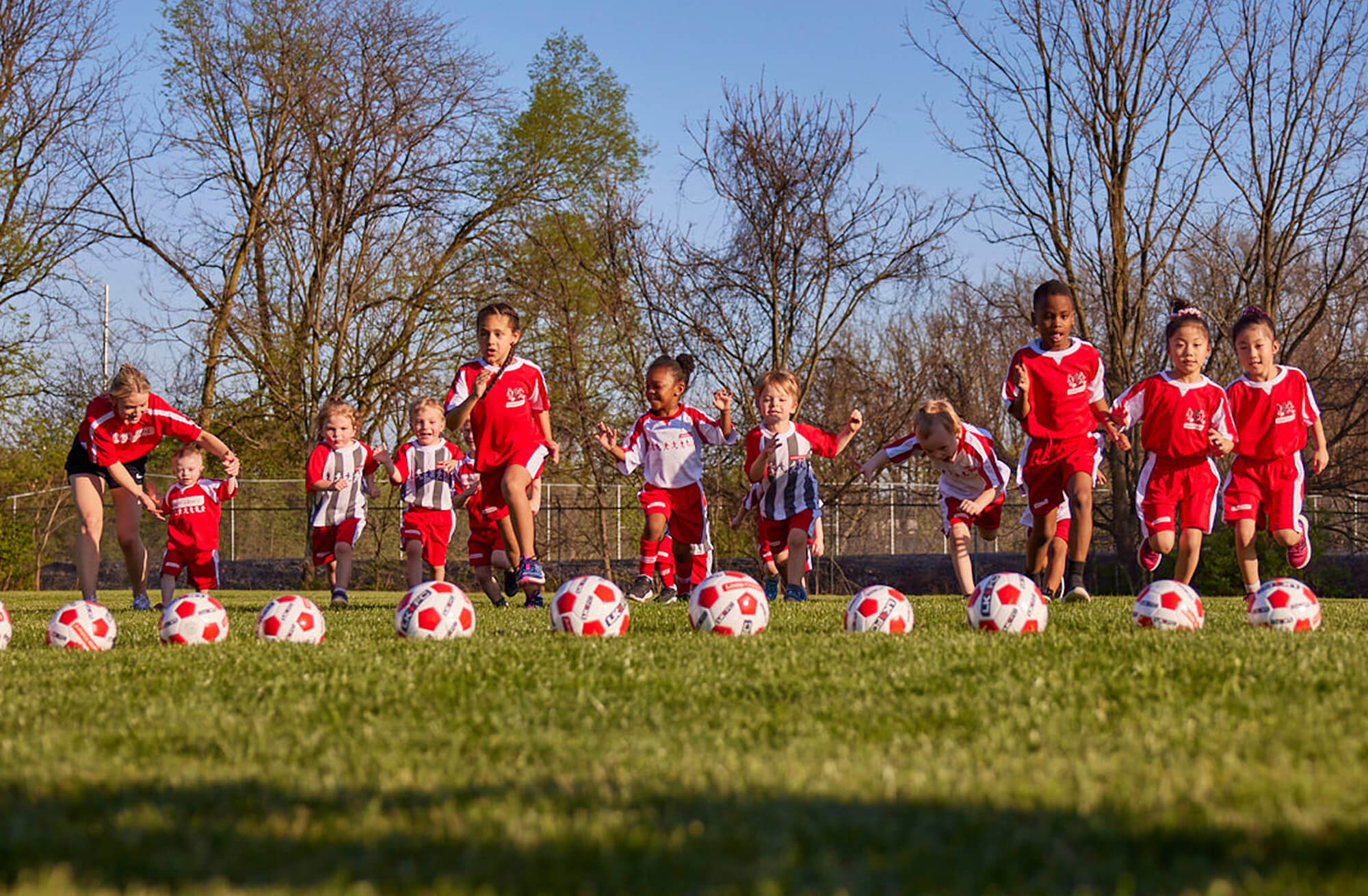 a group of kids playing football