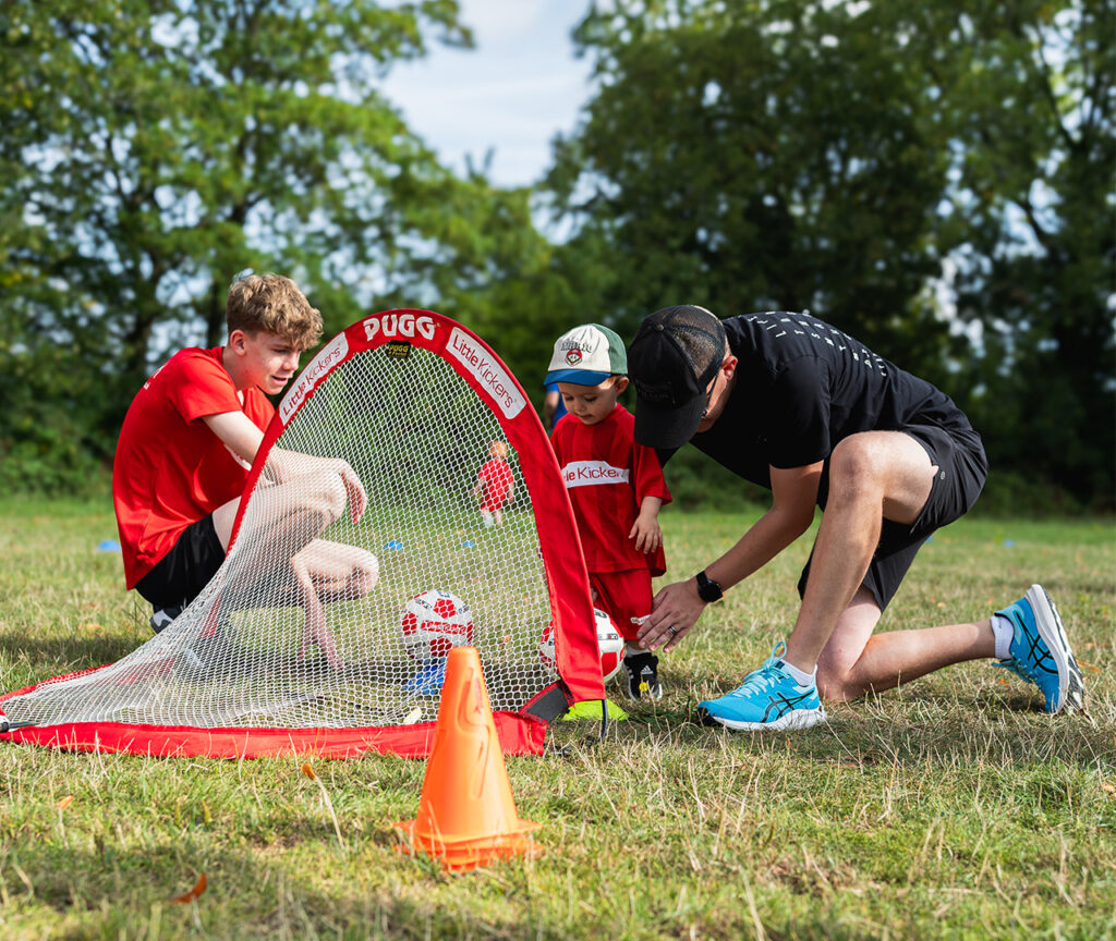 a group of kids playing in a field